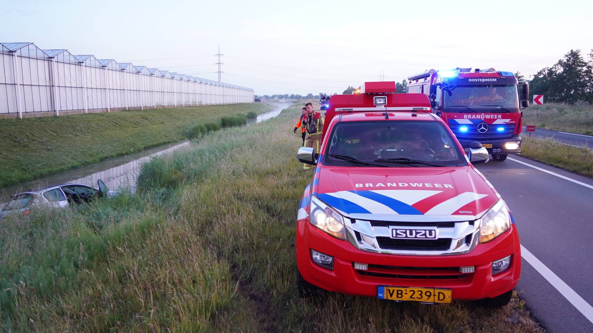 Automobiliste te water langs N470 bij Berkel en Rodenrijs