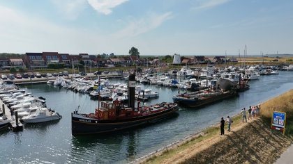 Van Schiedam naar Stavenisse: gerestaureerde molenkap weer thuis na bijzondere reis